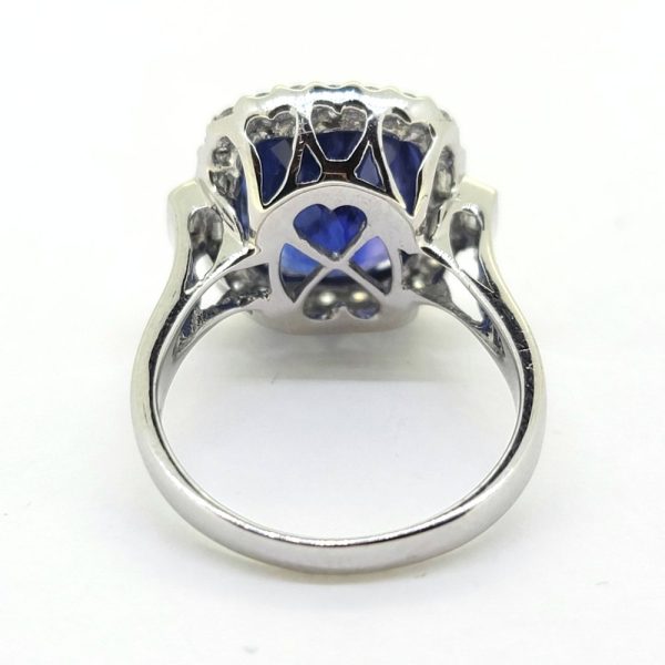 Fine 6.97ct Cushion Cut Sapphire and Diamond Cluster Ring, accented with baguette-cut diamonds to the shoulders in 18ct white gold
