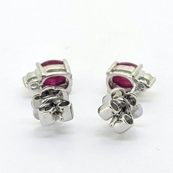 1.20ct Oval Ruby and Diamond Stud Earrings, oval-cut rubies with brilliant-diamond tops in 14ct white gold, with post and butterfly fittings