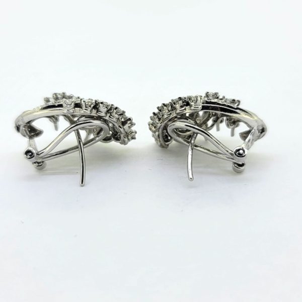 Pair of Diamond Spray Stud Earrings, each pair composed of diamonds set in a curved spray design
