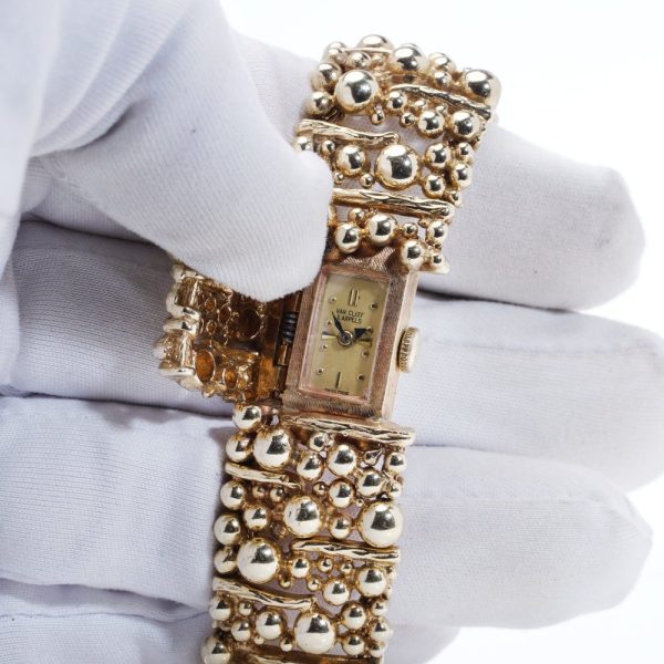 Van Cleef & Arpels gold bracelet watch.