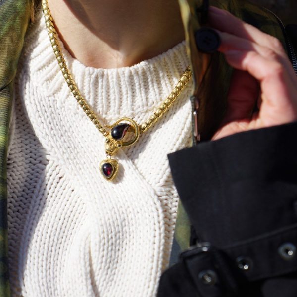 Victorian snake necklace with garnets and emeralds in gold.
