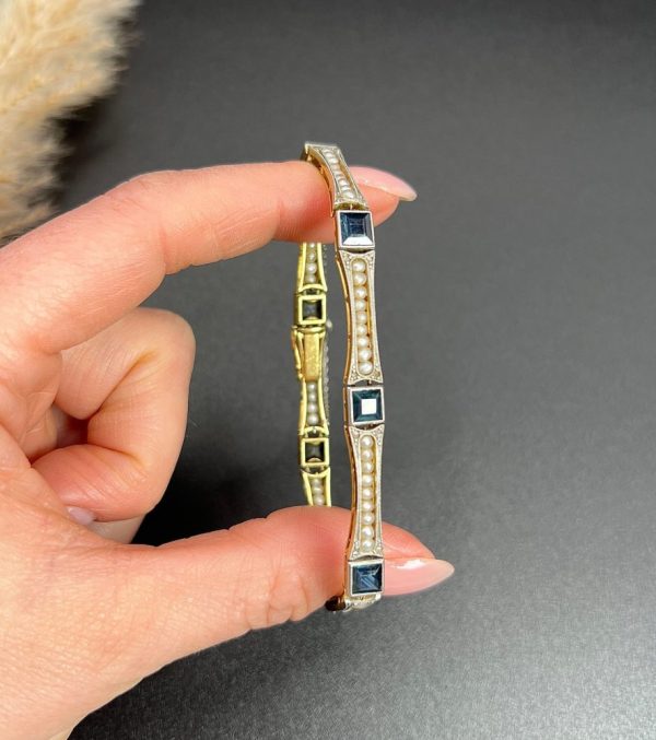 Edwardian Antique Sapphire and Seed Pearl Link Bracelet, long rectangular links with delicate row of natural seed pearls interspersed with square-cut sapphires in platinum and 18ct yellow gold.. Circa 1910