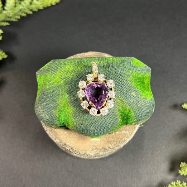 Antique Art Deco Heart Amethyst and Diamond Cluster Pendant, heart-shaped amethyst surrounded by halo of diamonds with diamond bail in 14ct yellow gold. Circa 1920s