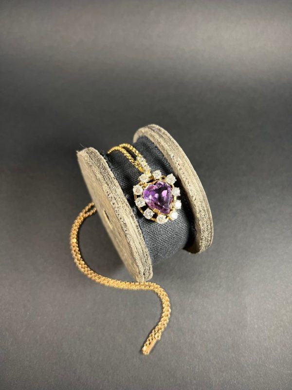 Antique Art Deco Heart Amethyst and Diamond Cluster Pendant, heart-shaped amethyst surrounded by halo of diamonds with diamond bail in 14ct yellow gold. Circa 1920s