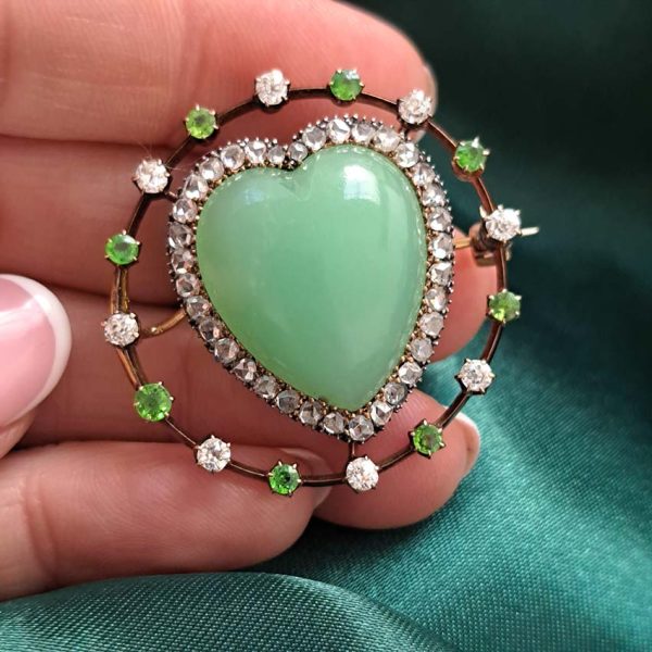 Antique Chalcedony Heart Brooch with Demantoid Garnet and Diamond, heart shaped cabochon chalcedony surrounded by fixed halo of alternating diamonds and demantoid garnets in 15ct yellow gold