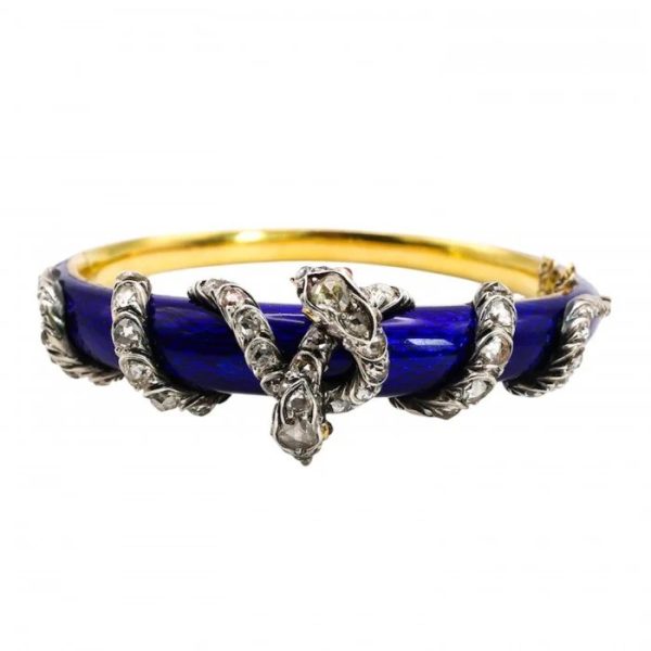 Victorian Antique Blue Enamel and Diamond Set Gold Snake Bangle Bracelet, two entwined diamond set silver snakes on dark blue guilloché enamel tapering hinged gold bangle. Mid 19th century Circa 1850. Presented in antique double door case