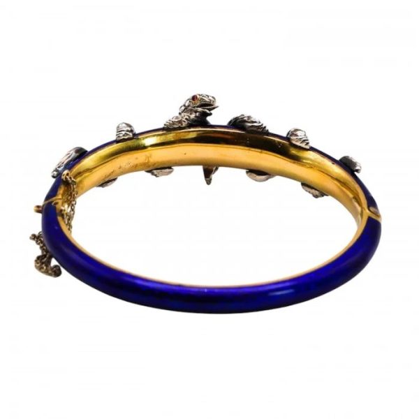 Victorian Antique Blue Enamel and Diamond Set Gold Snake Bangle Bracelet, two entwined diamond set silver snakes on dark blue guilloché enamel tapering hinged gold bangle. Mid 19th century Circa 1850. Presented in antique double door case