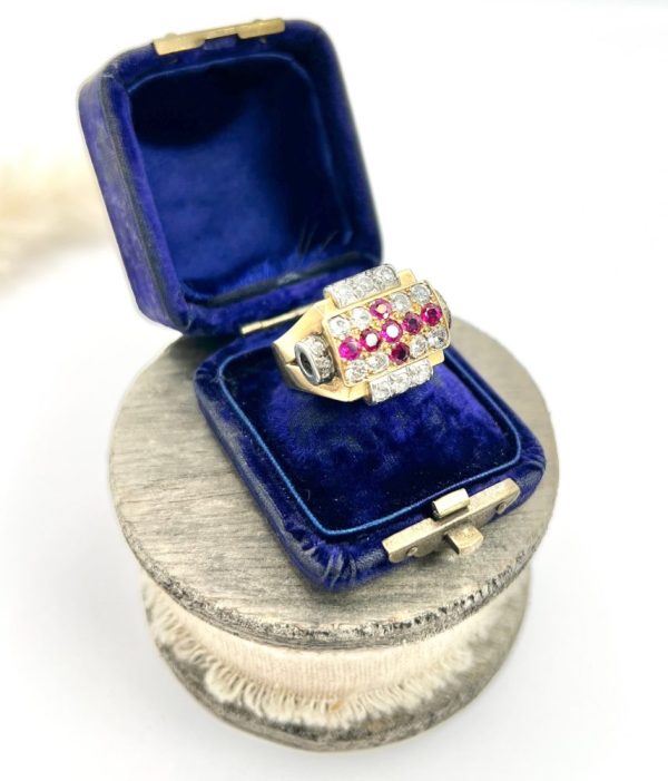 Late Art Deco French Ruby and Diamond Cross Tank Cocktail Ring, geometric statement ruby cross surrounded by sparkling diamonds with stepped shoulders in platinum to chunky 18ct yellow gold mount and band. Circa 1930s