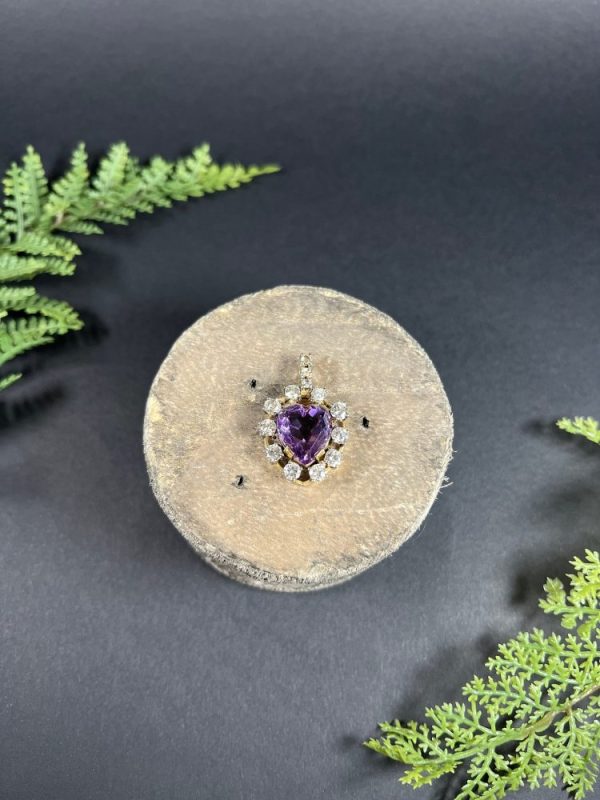 Antique Art Deco Heart Amethyst and Diamond Cluster Pendant, heart-shaped amethyst surrounded by halo of diamonds with diamond bail in 14ct yellow gold. Circa 1920s