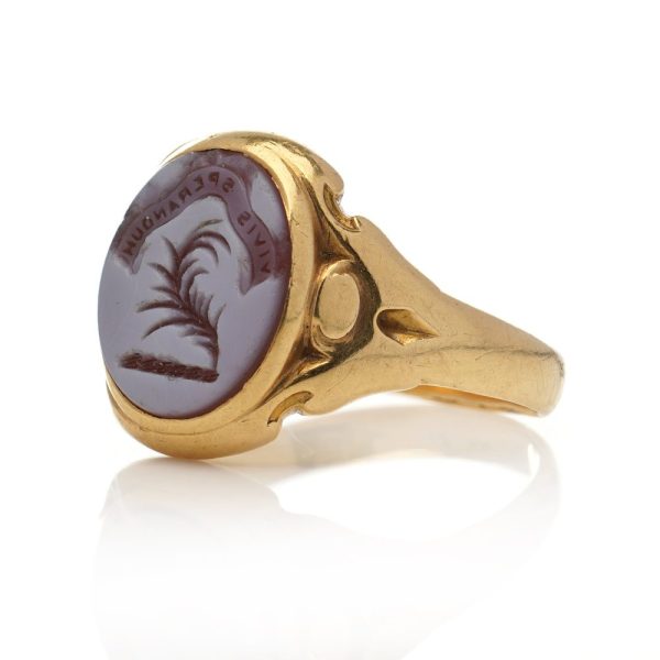 Victorian gold signet ring with an intaglio carved oval sardonyx.