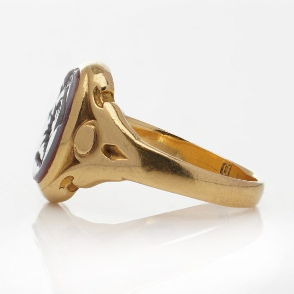 Victorian gold signet ring with an intaglio carved oval sardonyx.