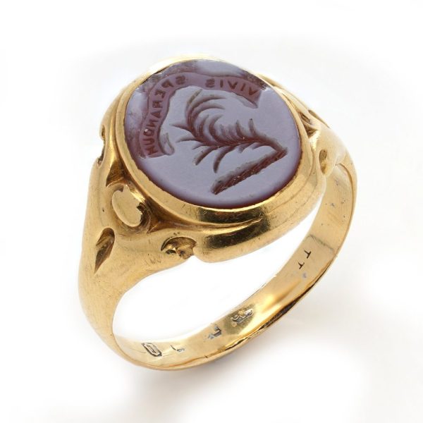 Victorian gold signet ring with an intaglio carved oval sardonyx.