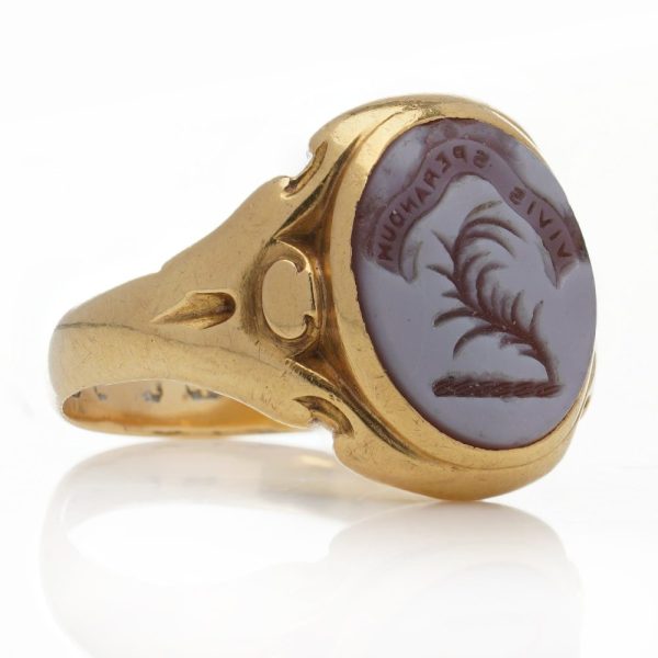 Victorian gold signet ring with an intaglio carved oval sardonyx.