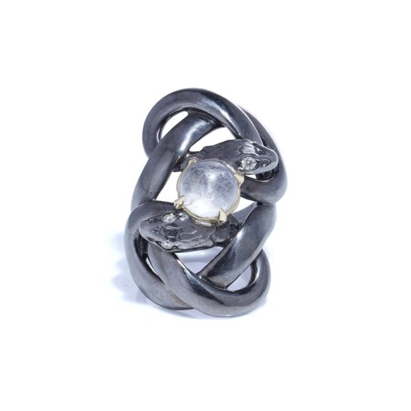 Silver and gold double snake ring with moonstone and diamonds.