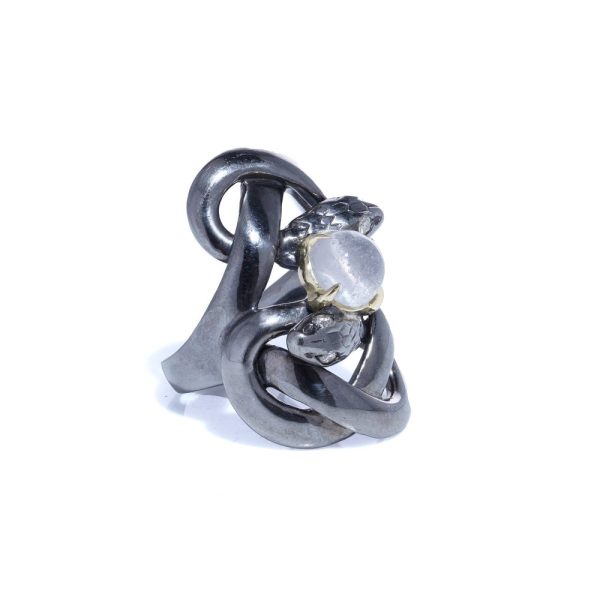 Silver and gold double snake ring with moonstone and diamonds.
