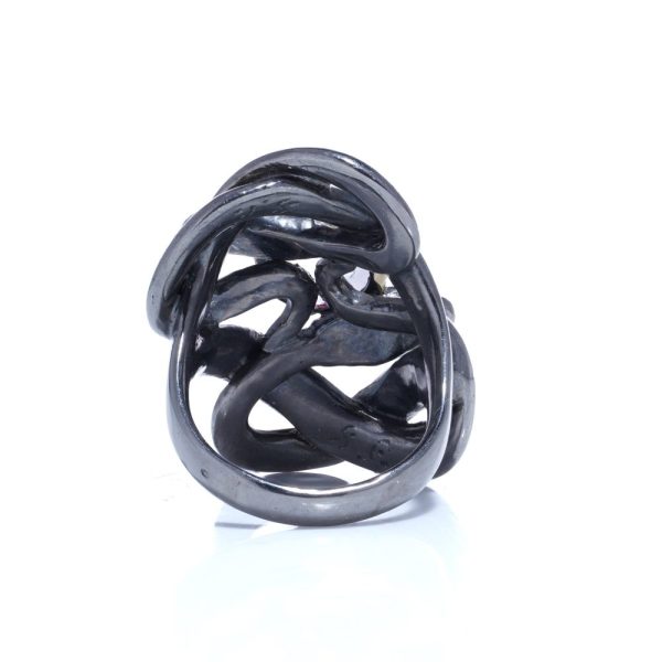 Silver and gold double snake ring with moonstone and diamonds.