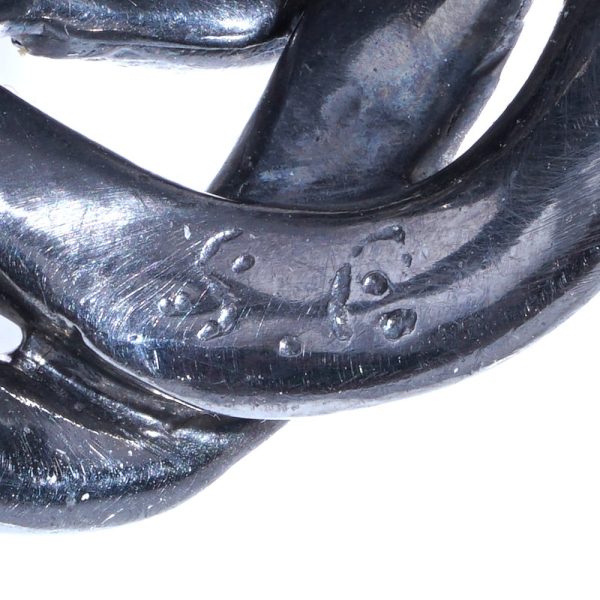 Silver and gold double snake ring with moonstone and diamonds.