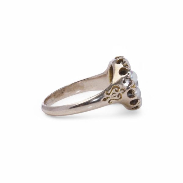 Antique diamond and pearl cluster ring in gold.