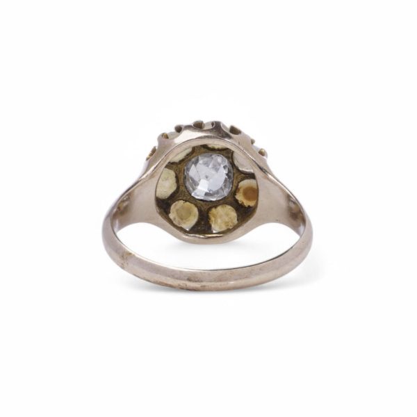 Antique diamond and pearl cluster ring in gold.