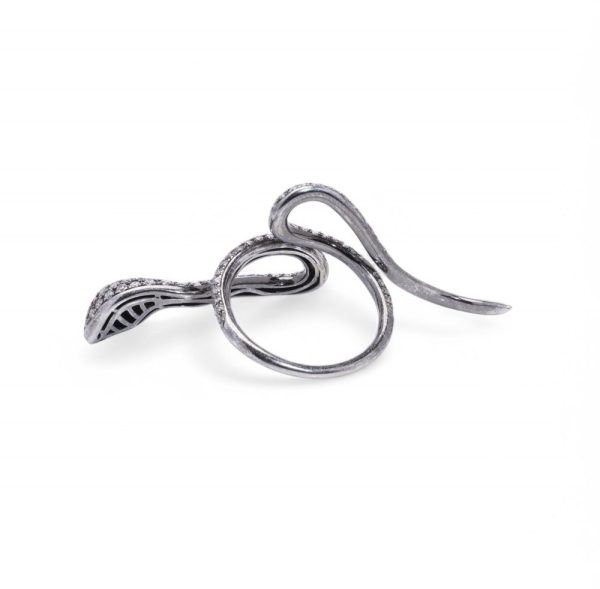 Diamond and ruby snake ring in white gold.