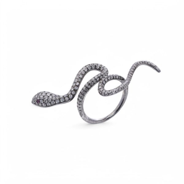 Diamond and ruby snake ring in white gold.
