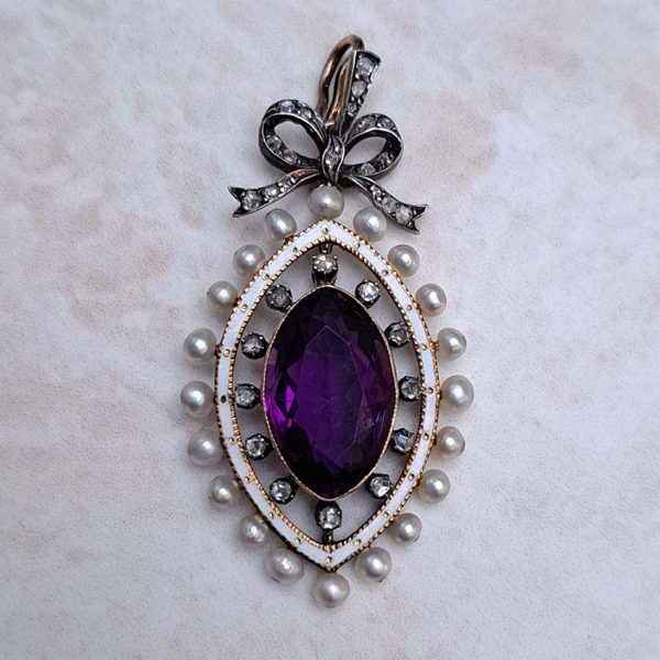 Edwardian Antique Marquise Amethyst Pearl and Diamond Pendant, marquise-cut amethyst surrounded by rose-cut diamonds within white enamel border with gold detailing and natural pearls to outer edge with diamond-set bow bail