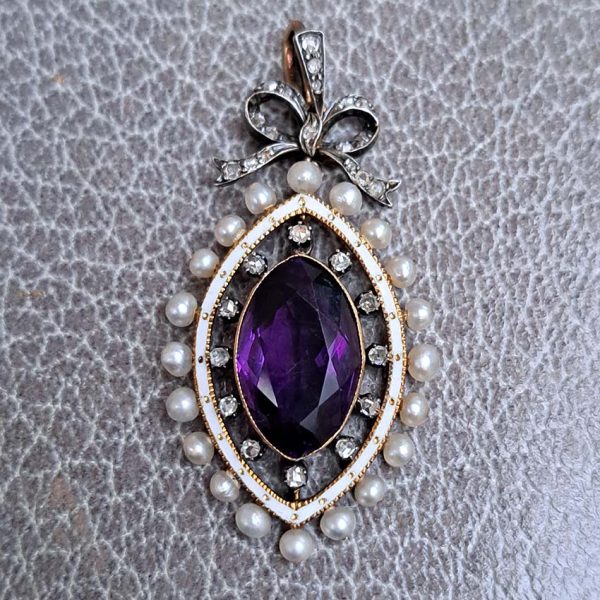 Edwardian Antique Marquise Amethyst Pearl and Diamond Pendant, marquise-cut amethyst surrounded by rose-cut diamonds within white enamel border with gold detailing and natural pearls to outer edge with diamond-set bow bail