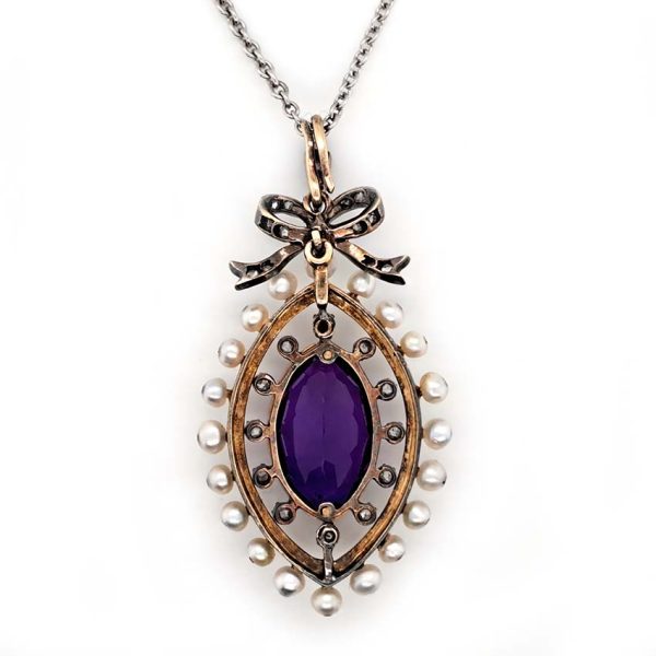 Edwardian Antique Marquise Amethyst Pearl and Diamond Pendant, marquise-cut amethyst surrounded by rose-cut diamonds within white enamel border with gold detailing and natural pearls to outer edge with diamond-set bow bail