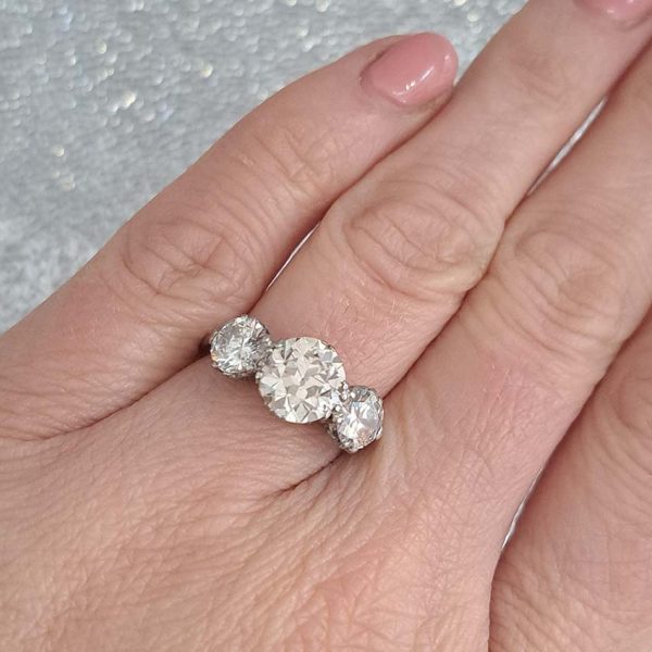 Antique Diamond Three Stone Trilogy Engagement Ring in Platinum, 3.21 carats, 2.01ct old European cut diamond flanked by 1.20cts diamonds with certificate