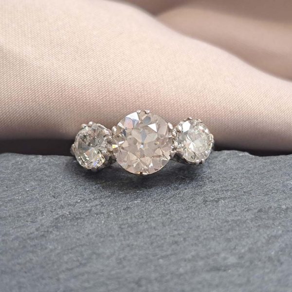 Antique Diamond Three Stone Trilogy Engagement Ring in Platinum, 3.21 carats, 2.01ct old European cut diamond flanked by 1.20cts diamonds with certificate
