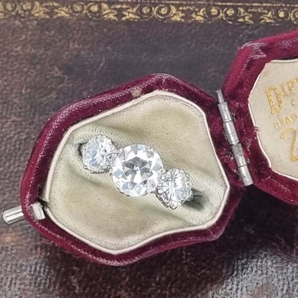Antique Diamond Three Stone Trilogy Engagement Ring in Platinum, 3.21 carats, 2.01ct old European cut diamond flanked by 1.20cts diamonds with certificate