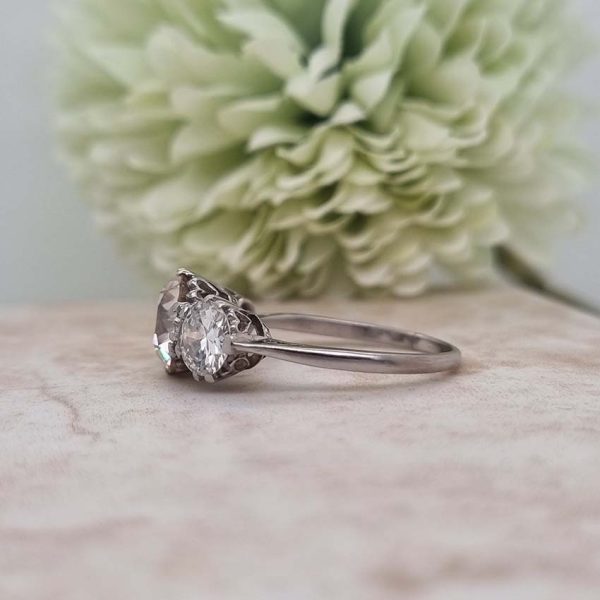 Antique Diamond Three Stone Trilogy Engagement Ring in Platinum, 3.21 carats, 2.01ct old European cut diamond flanked by 1.20cts diamonds with certificate