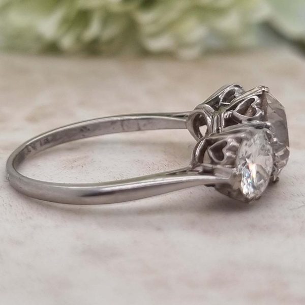 Antique Diamond Three Stone Trilogy Engagement Ring in Platinum, 3.21 carats, 2.01ct old European cut diamond flanked by 1.20cts diamonds with certificate
