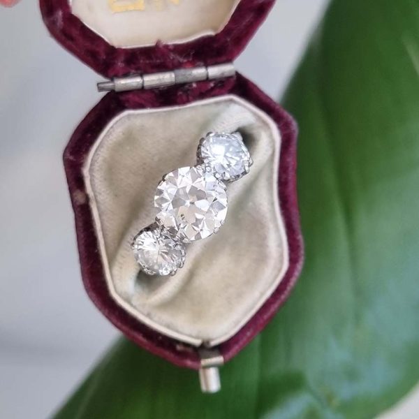 Antique Diamond Three Stone Trilogy Engagement Ring in Platinum, 3.21 carats, 2.01ct old European cut diamond flanked by 1.20cts diamonds with certificate