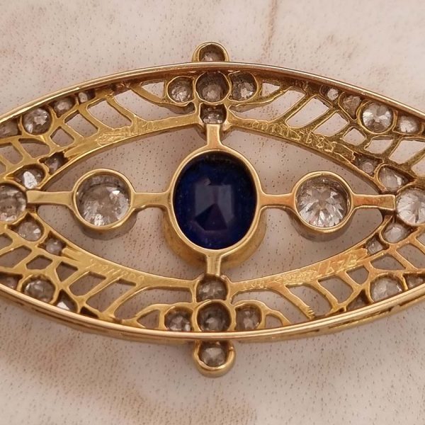 Edwardian Antique 1ct Sapphire and 1.10ct Old Cut Diamond Navette Brooch in 18ct Yellow Gold and Platinum, Circa 1900