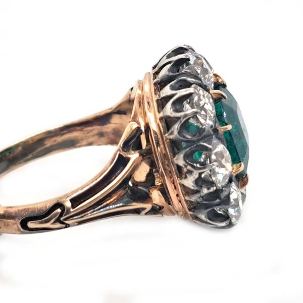 Georgian Regency Antique 2.85ct Colombian Emerald and 4.80ct Old Mine Cut Diamond Cluster Ring in silver upon gold with decorative carved split shank. Circa 1830