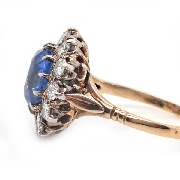 Antique Art Deco 4.50ct Cornflower Blue Ceylon Sapphire and 1.20ct Diamond Cluster Engagement Ring in 18ct white and yellow gold. Circa 1920