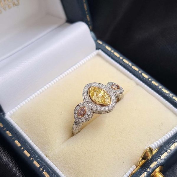 GIA Certified 0.72ct Fancy Vivid Yellow and Pink Marquise Diamond Trilogy Cluster Engagement Ring in Platinum by Hancocks