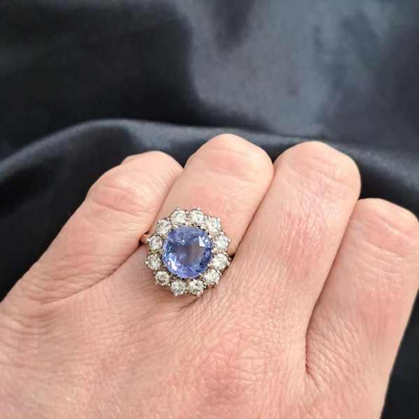 Antique Art Deco 4.50ct Cornflower Blue Ceylon Sapphire and 1.20ct Diamond Cluster Engagement Ring in 18ct white and yellow gold. Circa 1920