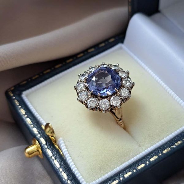 Antique Art Deco 4.50ct Cornflower Blue Ceylon Sapphire and 1.20ct Diamond Cluster Engagement Ring in 18ct white and yellow gold. Circa 1920