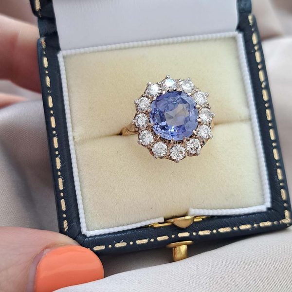Antique Art Deco 4.50ct Cornflower Blue Ceylon Sapphire and 1.20ct Diamond Cluster Engagement Ring in 18ct white and yellow gold. Circa 1920