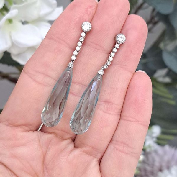 Briolette Aquamarine and Diamond Long Drop Earrings, elongated pear-shaped briolette-cut aquamarines of a blue-green colour suspended from diamond line tops