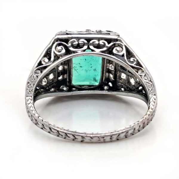 Belle Epoque Edwardian Antique 2.10ct Emerald and Diamond Cluster Ring in Platinum, 2.10ct rectangular step-cut vivid green emerald in diamond mount with openwork design to shoulders and scrolling gallery with engraved shank. Circa 1900
