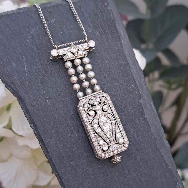 Tiffany and Co Art Deco 2.10ct Diamond Natural Pearl and Platinum Watch Pendant, Circa 1925. Movement signed C H Meylan