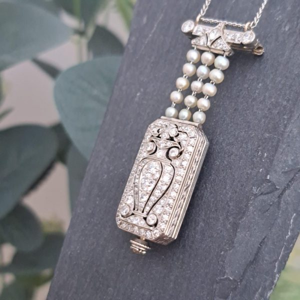 Tiffany and Co Art Deco 2.10ct Diamond Natural Pearl and Platinum Watch Pendant, Circa 1925. Movement signed C H Meylan