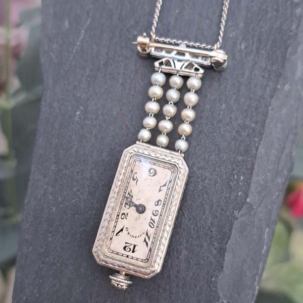 Tiffany and Co Art Deco 2.10ct Diamond Natural Pearl and Platinum Watch Pendant, Circa 1925. Movement signed C H Meylan