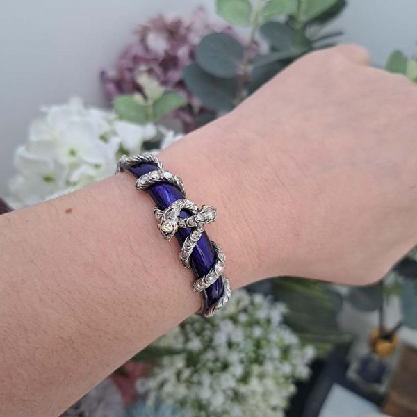 Victorian Antique Blue Enamel and Diamond Set Gold Snake Bangle Bracelet, two entwined diamond set silver snakes on dark blue guilloché enamel tapering hinged gold bangle. Mid 19th century Circa 1850. Presented in antique double door case