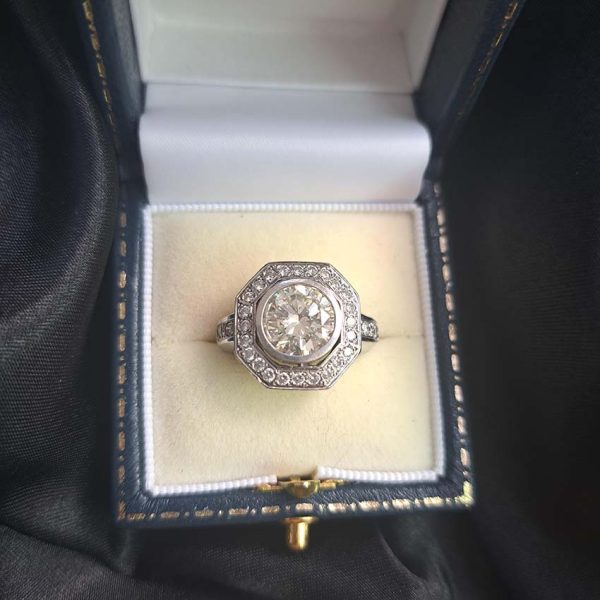 Vintage 2.70ct Diamond Octagonal Cluster Ring in 18ct White Gold, over 3 carat total, 2.7ct round brilliant-cut diamond in octagonal diamond border with diamond shoulders. 3.34 carat total