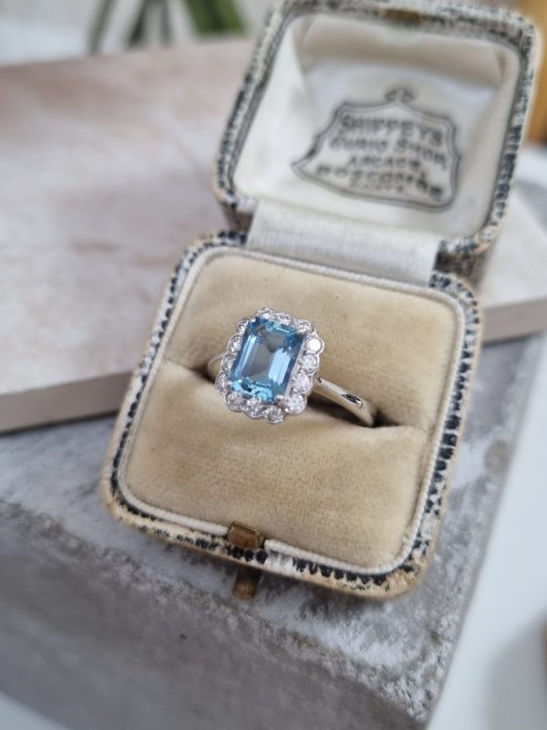 Aquamarine and diamond cluster ring set in 18ct white gold