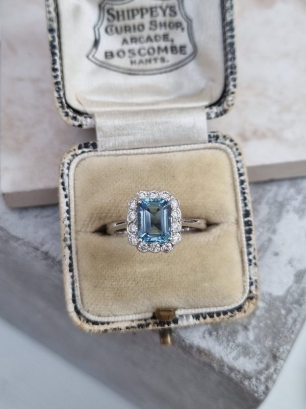 Aquamarine and diamond cluster ring set in 18ct white gold